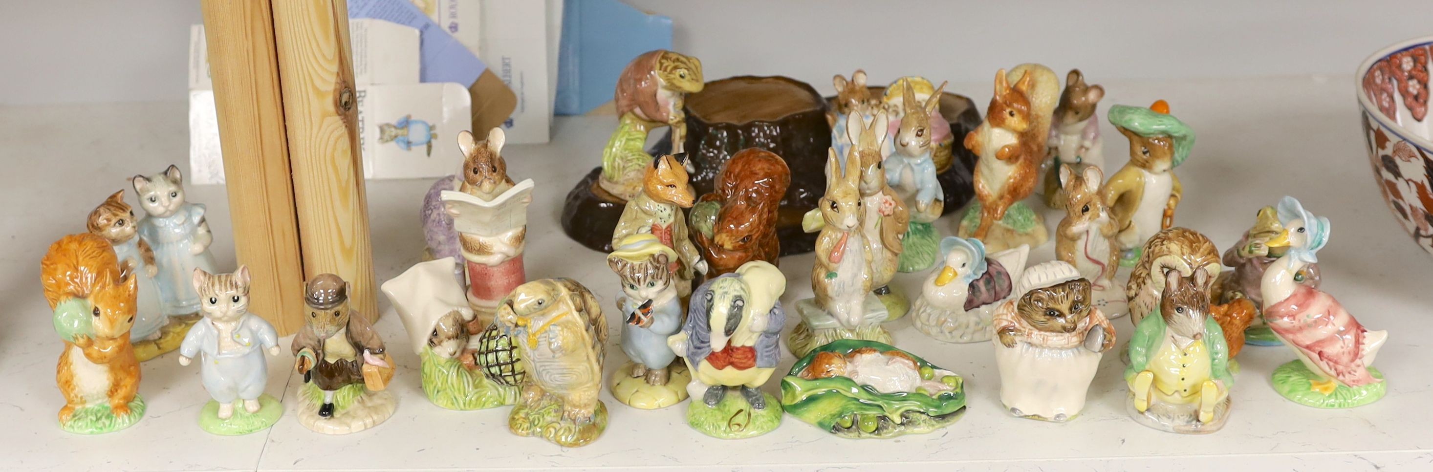 A collection Beswick, Royal Albert and Border Fine Arts Beatrix Potter figures